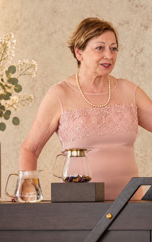 Maria, the founder of Decadent Teas, at her tea trolley